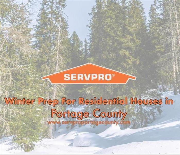 Orange SERVPRO house logo on a winter image with snow and trees. 