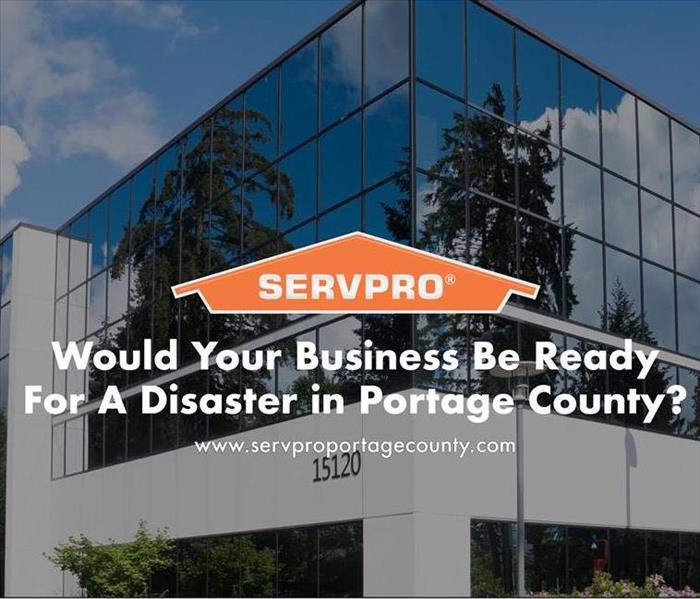 Orange SERVPRO  house logo on image with business building in background 